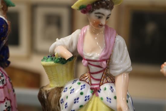 A Samson Derby figure of a lady and a pair of Paris porcelain figures